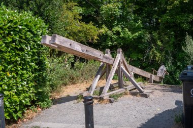 A replica of a wooden medieval ducking stool, or scolds stool located on the banks of the river Avon at Christchurch in Dorset
