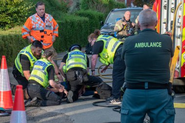 Trowbridge Wiltshire UK Aug 25 2022. Officers from the Wiltshire police service arresting a combative individual at an ongoing incident while members of other emergency services look on