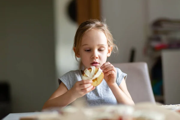 Little girl helping with baking at home