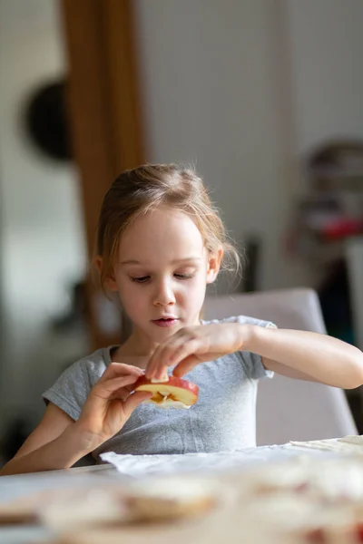 Little girl helping with baking at home