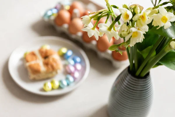 spring easter holiday. beautiful background with eggs and flower on a white plate.
