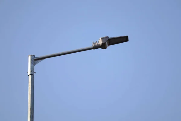 stock image single street light with empty blue sky