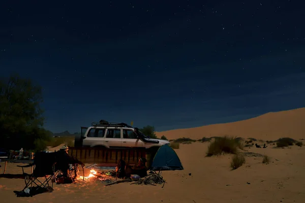 STARRY NIGHT AND THE DESERT LANDSCAPE IN THE SAHARA DESERT IN ALGERIA