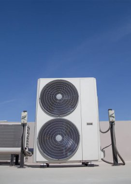 Air conditioning (HVAC) installed on the roof of industrial buildings.