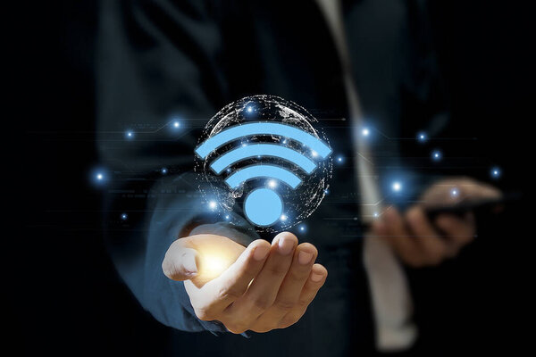 Businessman using laptop with wifi icon. Business communication social network concept.