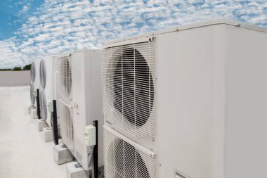 Air conditioning (HVAC) installed on the roof of industrial buildings.
