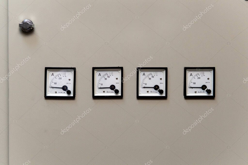 Analog voltmeter, amp meter and signal lamp on control panel of power