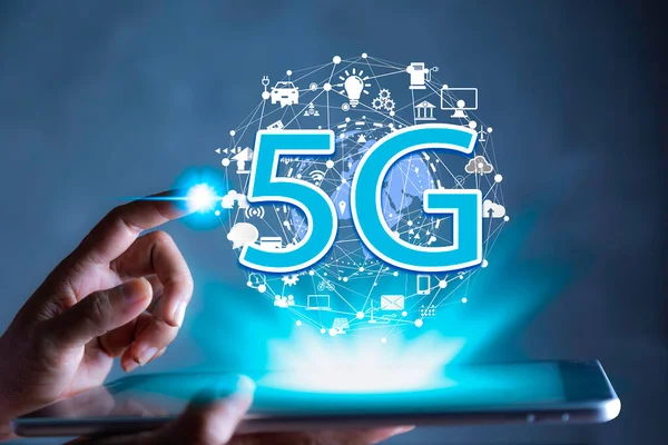 stock image 5G Technology networks Internet connecting wireless devices around the world. 5G technology is essential to businesses in the digital world with smartphones in hand and icons connected to each othe