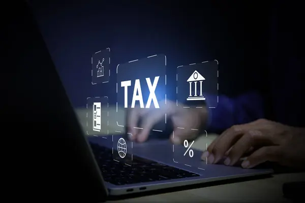 income tax concept. Businessman using laptop analyzing data to online income tax form. tax system icon around. pay online income tax. futuristic virtual screen interface technology.