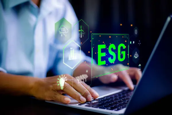 stock image green energy esg concept. Businessman using laptop analyzing big data to net zero icon. Carbon emissions must be zero within year 2050. Environmental, social,Governance. Green energy icon around