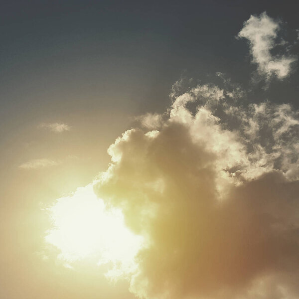 Sun rays with clouds in the sky background texture