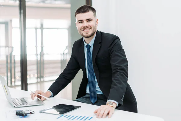 stock image Young businessman smiling working in the office