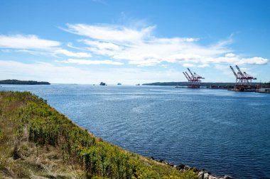 Harbour cranes and ships view from Georges Island - Halifax, Nova Scotia, Canada