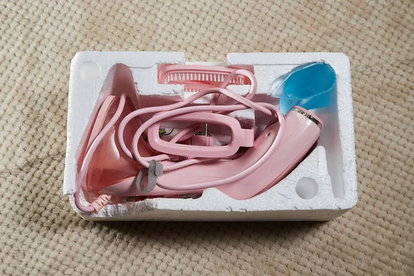 Pink Steamer iron close up. Household appliances photographed for sales