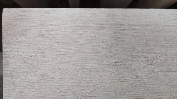 White texture and background with volumetric paint strokes on wooden boards and surfaces. White paint texture with a pattern. Background for wallpaper and cards. Wedding white look