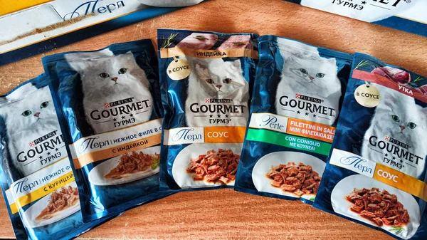 Kirov, Russia - March 09, 2023: Packages of wet cat food. Gourmet is brand of wet and dry cat food and treats