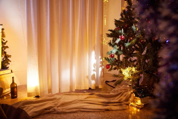 Interior with decorated cristmas tree in cozy room. Location for a photo shoot in studio