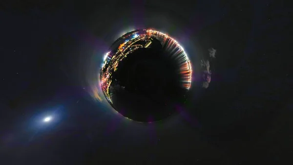 A tiny planet view of the ports of Harwich and Felixstowe at night in the UK