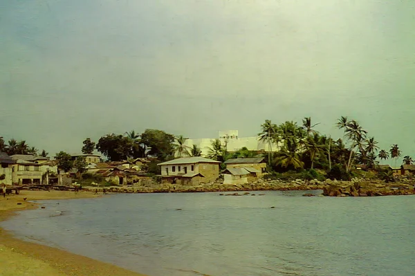 stock image The beach and Fort Metal Cross (previously known as Fort Dixcove) in Dixcove, Ghana c.1959