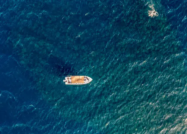 Stock image An aerial view of a boat above a large school of Munk's Devil Rays aka Mobula Rays (Mobula munkiana) in Baja California Sur, Mexico