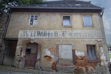 A derelict shop in the centre of Colditz, Saxony, Germany clipart