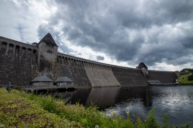 The Mohne Dam was built in 1912 and has created the Mohne Reservoir in North Rhine-Westphalia, Germany clipart