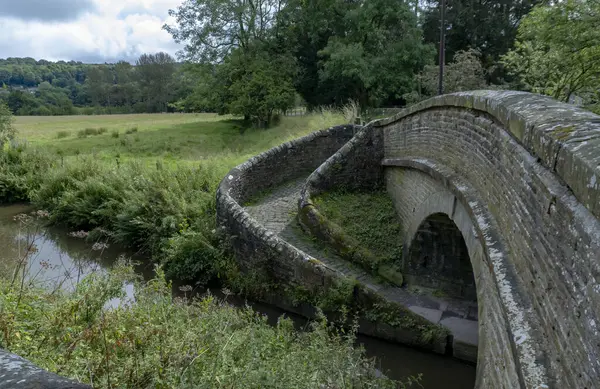 stock image A 19th century spiral bridge spanning the Macclesfield Canal at Bollington, Cheshire, UK