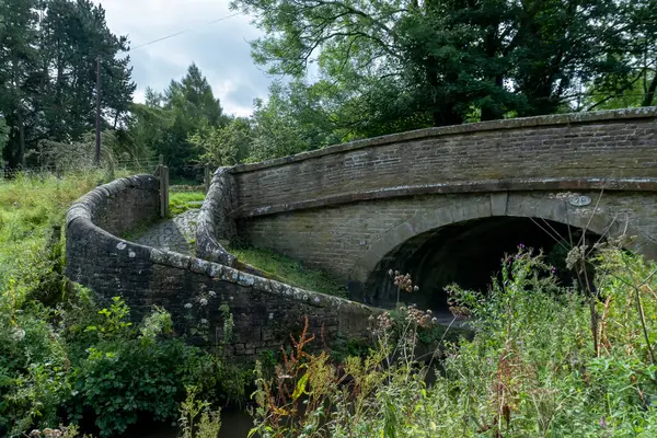 stock image A 19th century spiral bridge spanning the Macclesfield Canal at Bollington, Cheshire, UK