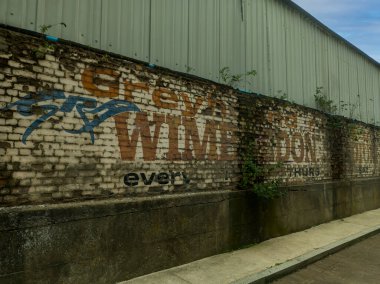 An old wall advert for Wimbledon Greyhounds outside the Cherry Red Records Stadium in south west London, UK clipart