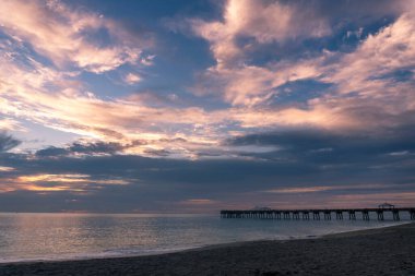 A colourful sunrise over Juno Beach, Florida, USA clipart