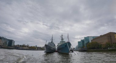 The Brazilian Navy training ship NE Brazil (U27) moored alongside HMS Belfast on the River Thames in London, UK clipart