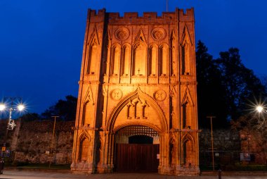 The illuminated Abbey Gate is the entrance to the Abbey Gardens in Bury St Edmunds, Suffolk clipart