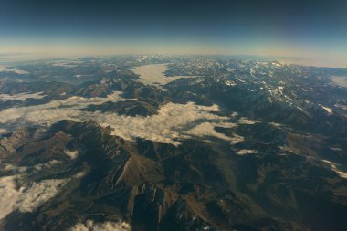 Flying over the French Alps on a clear Autumn morning clipart