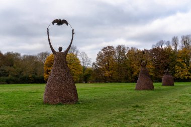 The Last Survivors willow statues at Runnymede in Surrey, UK clipart