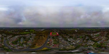 A 360 degree aerial view of the Peninsula Stadium, home of Salford City FC in Greater Manchester, UK clipart