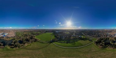 A 360 degree aerial view of the football grounds of Goodison Park and Anfield in Liverpool, UK clipart