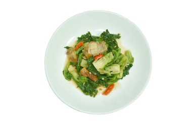 Kızarmış Brüksel lahanası ve dilimlenmiş istiridye soslu domuz eti. 