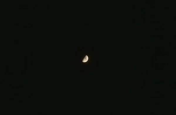 half moon on dark sky in night