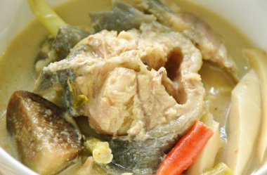 spicy boiled catfish with bamboo shoot and yard long bean couple eggplant in fermenting fish sauce soup on bowl