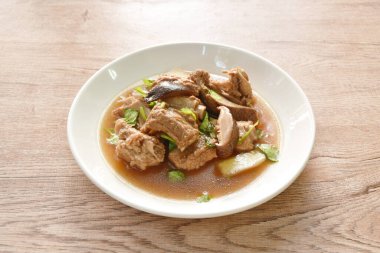 boiled pork bone with Chinese herb stew on plate