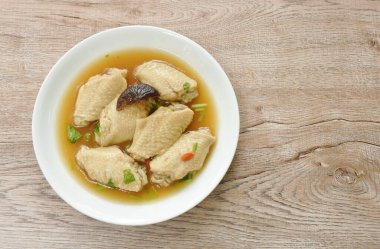boiled chicken wing with Chinese herb stew on plate 