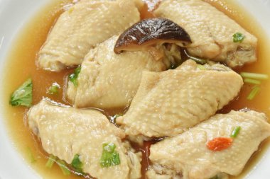 boiled chicken wing with Chinese herb stew on plate 