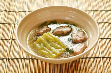 boiled bitter melon with  pork bone in clear soup on bowl