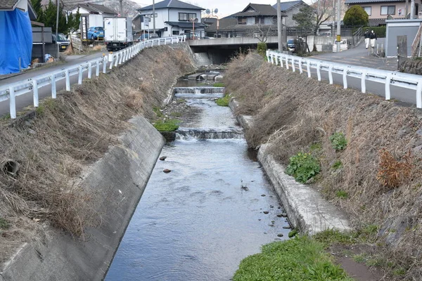 flush way for drain water and protect flooding in street at Yufuin Japan