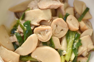stir fried mixed mushroom with pork in oyster sauce on plate
