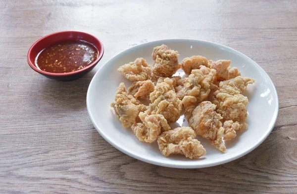 stock image crispy fried Korean chicken with bread crumb and egg yolk on plate dipping barbecue sauce