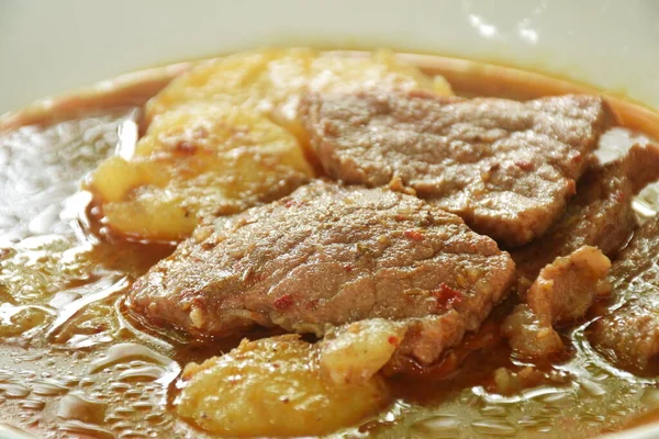 beef curry or Mussamun Indian food with slice potato on plate