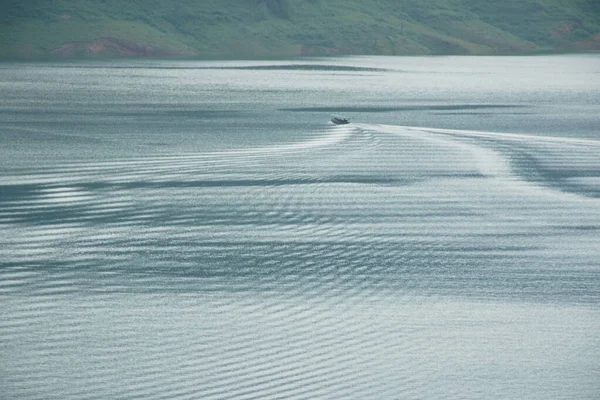 landscape of boat running on water reservoir lake make wave spreading background