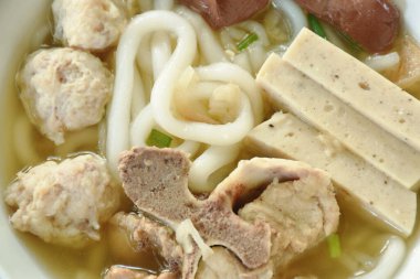Vietnamese rice noodles or Pho with slice sausage and chop pork couple blood in soup on bowl 