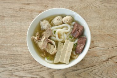 Vietnamese rice noodles or Pho with slice sausage and chop pork couple blood in soup on bowl 